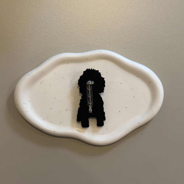 Cute dog figurine in black sweater with star design – collectible gift for dog lovers