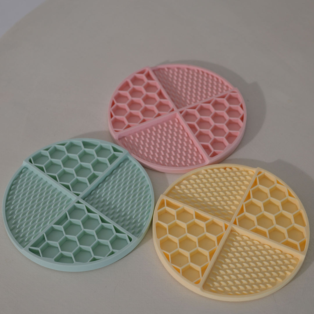 Colorful set of silicone enrichment mats for dogs and cats – honeycomb and flower designs for mealtime fun and digestion support.